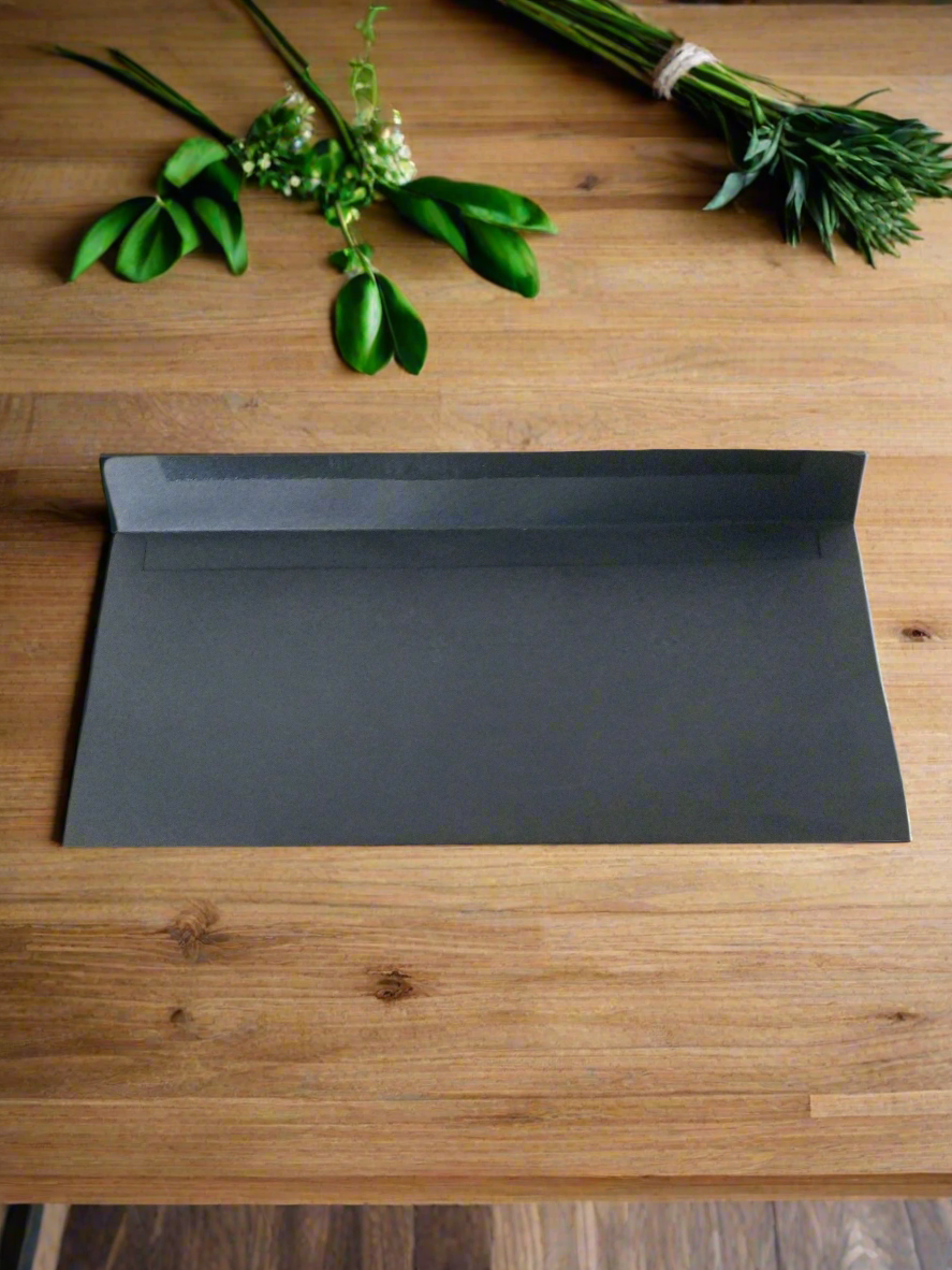 A bundle of 10 black envelopes.